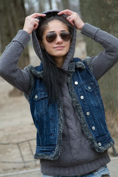 Engaging teen Malina A highlights her tiny tits and poses naked in a solo