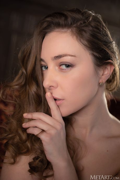 Perfect teen Emerald Ocean strips her clothes and poses nude in the library