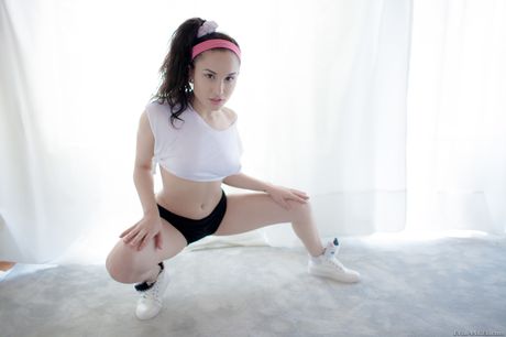 Evil Angel: Tattooed chick Gabriella Paltrova bares herself on a bed in high heels