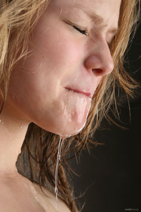 Winsome teen Mia C takes a shower while completely naked