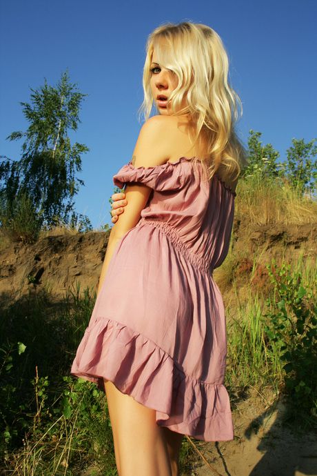 Engaging teen Tanusha A strips and poses naked in a solo shoot