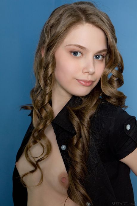 Delicate teen Kristel A highlights her big tits and trimmed pussy in the nude