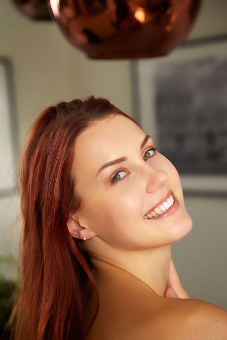 Delicate teen Charlie Red removes a yellow bodysuit to pose nude