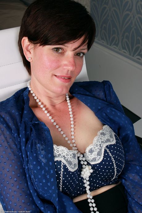 Over 30 woman Olivia G bares it all in black stockings and heels