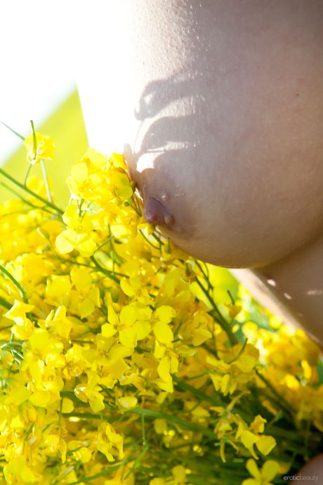 Tender teen Darselle models totally naked in a secluded area of the forest