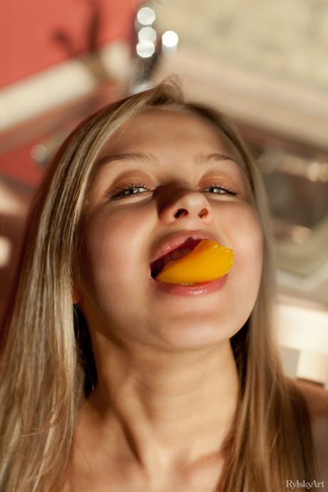 Blonde teen Luciana spreads her long legs wide open to show her bald pussy