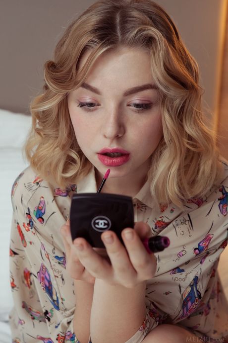 Blonde teen Daniel Sea removes a shirt to get naked on a hotel bed