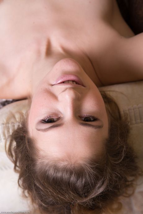 Blonde teen Amanda D removes mesh stockings to get totally naked