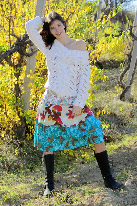 Desirable teen Ivanna B strips her long skirt & spreads her legs outdoors