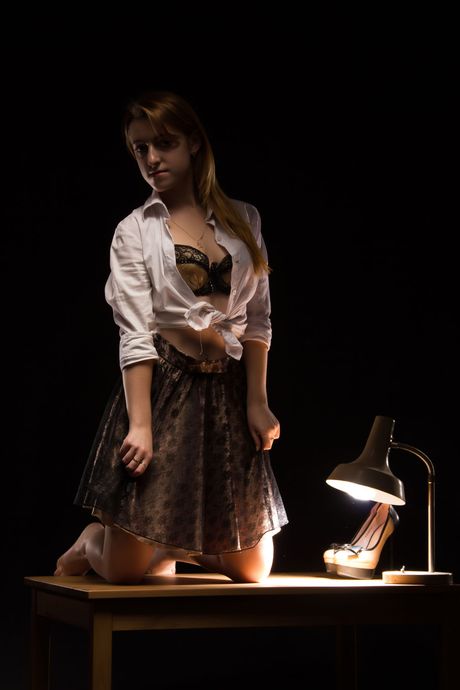 Angelic teen Juliya removes her lingerie to get naked on a desk in an office