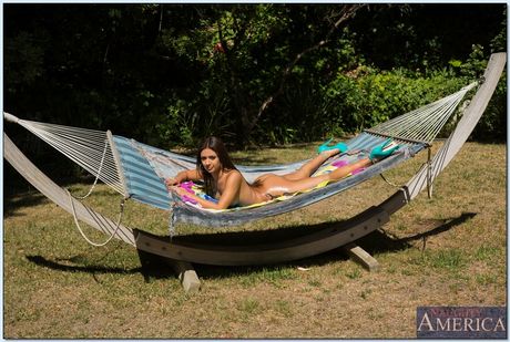 Latina teen Jynx Maze strips and shows her pierced pussy and ass