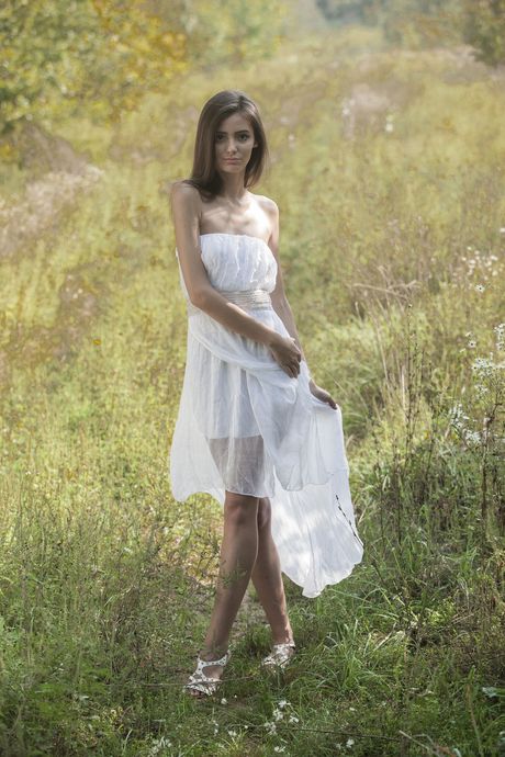 Thin teen Sunshine A shows her tiny tits and bald pussy in the nude