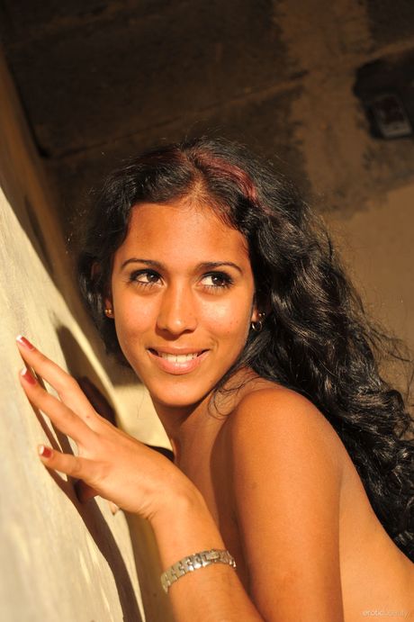 Brunette teen Luida models totally naked on a rocky outcropping