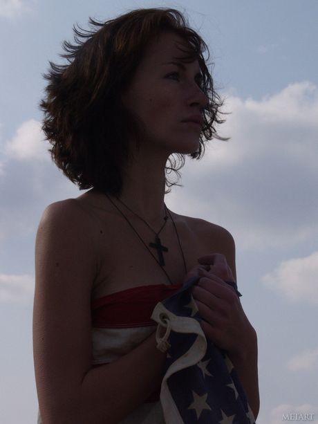 Lovely teen Models No Name strips naked on a motorcycle in a backyard