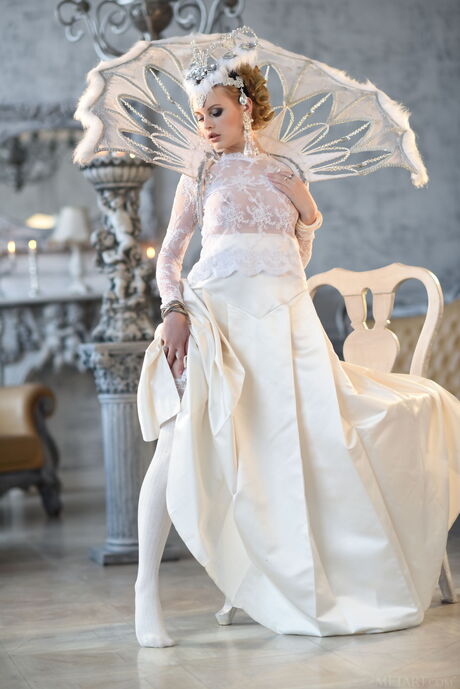 Blonde Russian lovely Angelika D gets naked in white stockings