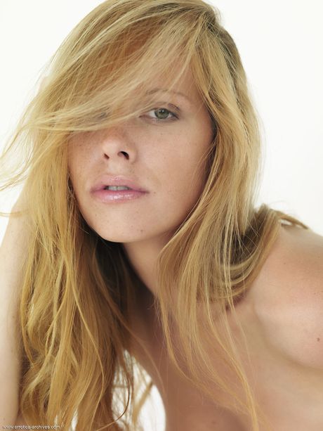 Blonde teen Tubbea strikes great solo poses while completely naked