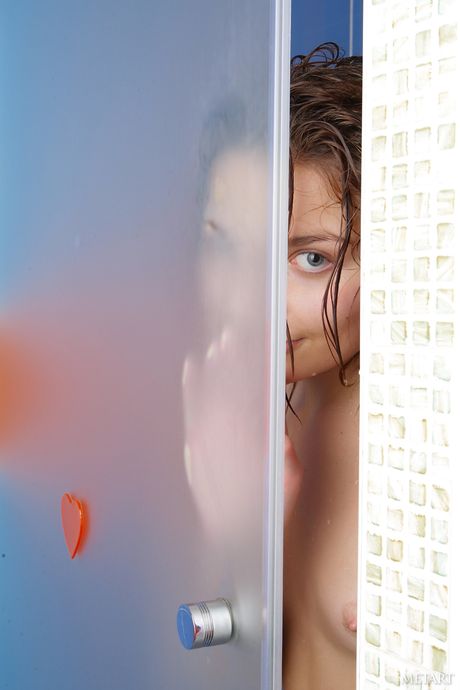 Cute teen Guerlain A takes a shower while totally naked
