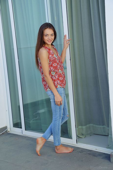 Sweet young girl Angely Grace gets completely naked on a patio chair