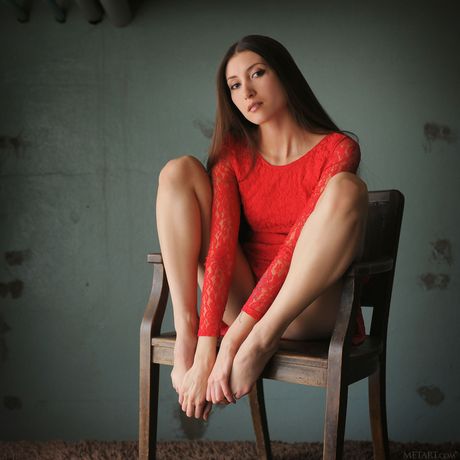 Beautiful teen Saju A removes a red dress to pose nude in high heels