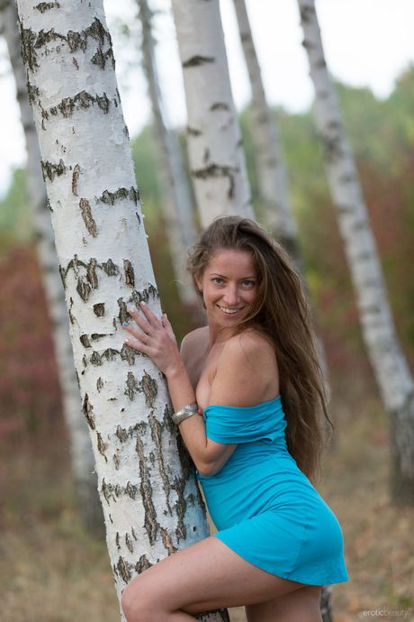 Delicate teen Mika A bares her body in a forest while alone