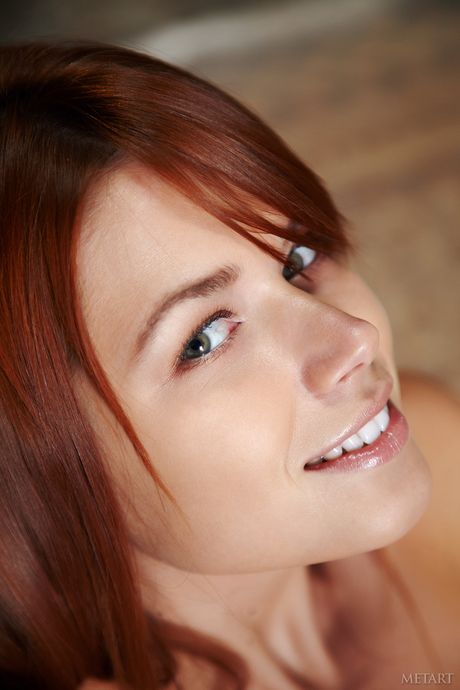 Thin teen Kami A displays her big tits and bald pussy in the nude