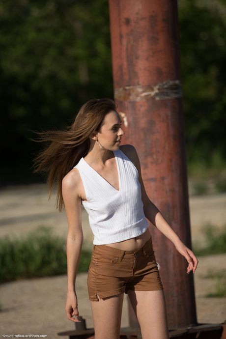 Glamorous teen Gracie strips and goes naked in the middle of the forest