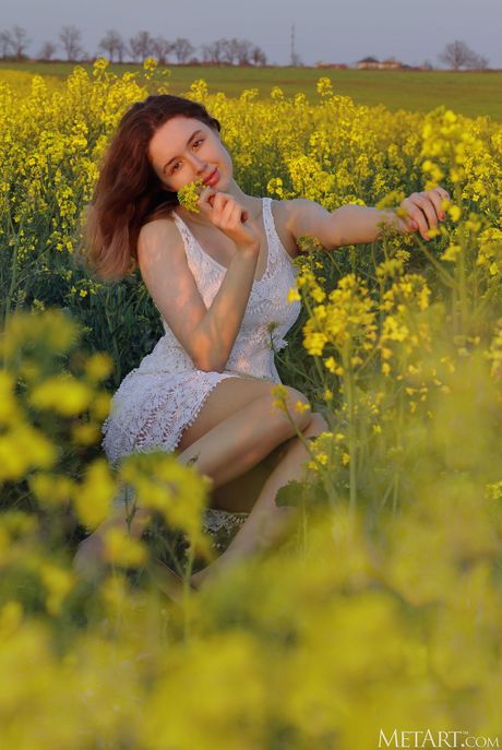 Lovely teen Riccarda strips down with grace on a patio