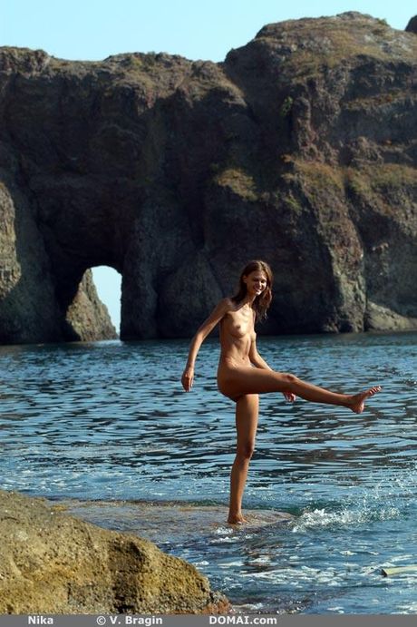 Slender teen Nika R shows her small tits and hot ass in the shower outdoors