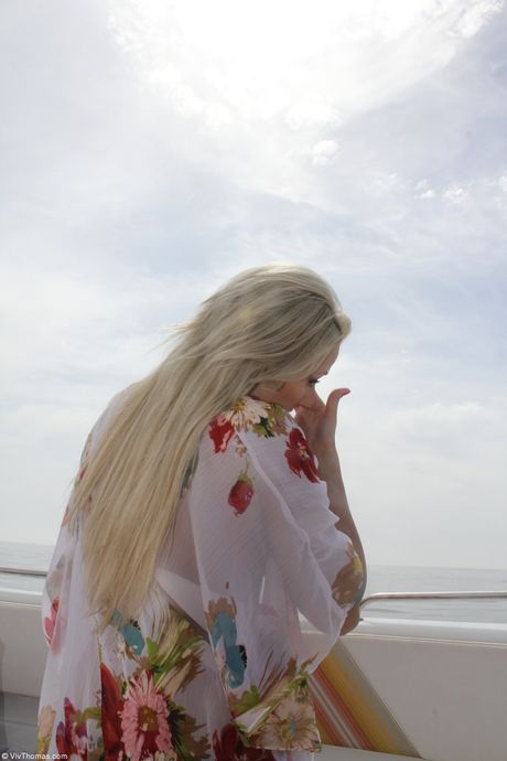 Hot teen Eve Angel gets naked in socks on a patio in a sexy outdoor strip