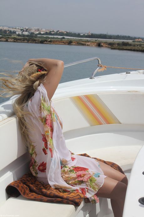 Hot teen Eve Angel gets naked in socks on a patio in a sexy outdoor strip