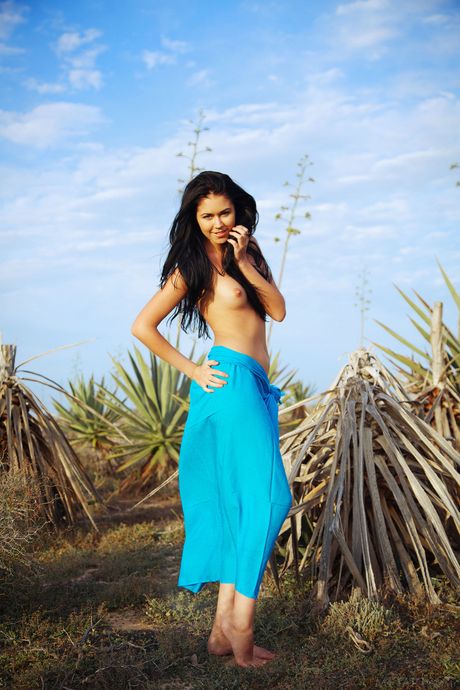 Sexy Ukrainian model Macy B posing naked outdoors to show her big tits