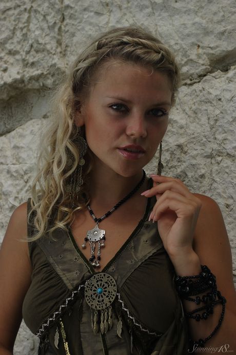 Blonde teen Elka gets naked on a beach and shows her tiny tits & shaved pussy