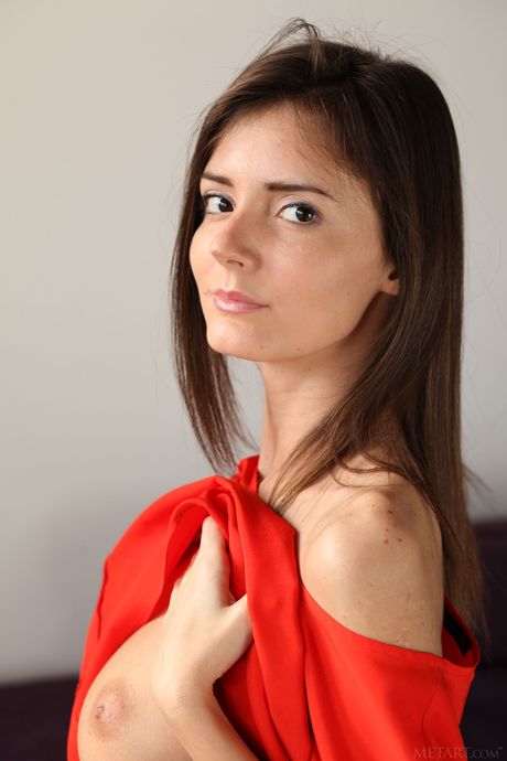 Desirable teen Sunshine A removes her bikini and socks to pose nude