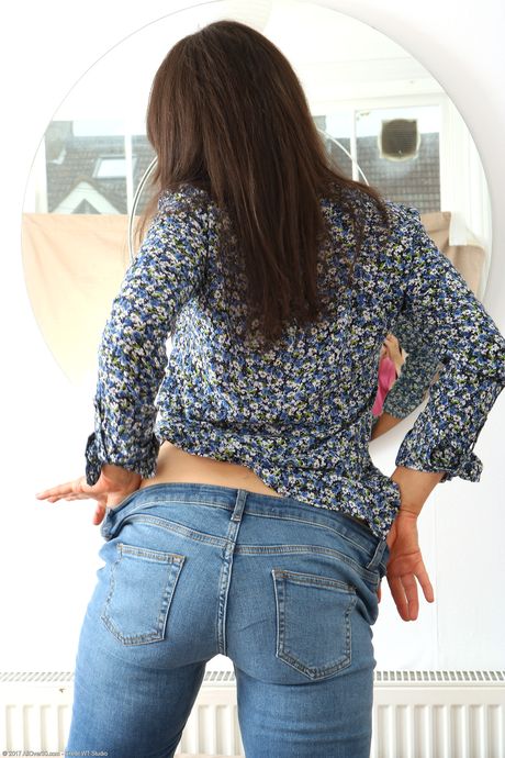 Hungarian MILF Lucy Love strips and shows her big booty and holes