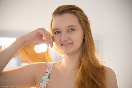 Young blonde Ena gets completely naked in front of a mirror during solo action