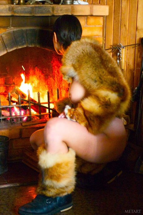 Magnetic teen Hilary A removes her boots to pose nude in a pair of thigh highs