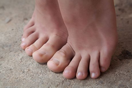 Lovely teen Antea models totally naked on a blanket in a backyard by herself