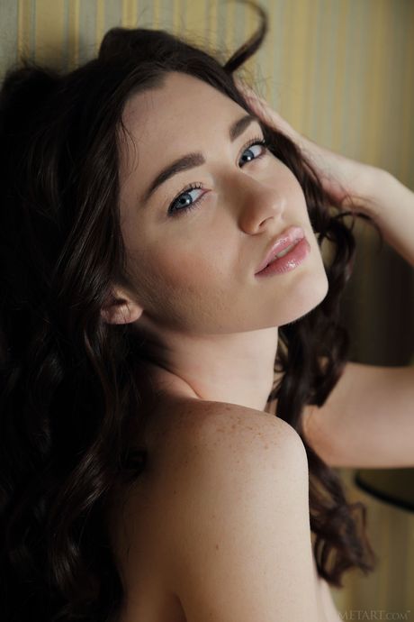 Svelte teen Zsanett Tormay strips and poses nude in a solo