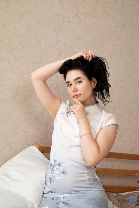 Tempting teen Jenny Doe undresses and masturbates on the bed