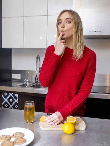 Sexy Ukrainian babe Oxana Chic strips and masturbates in the kitchen