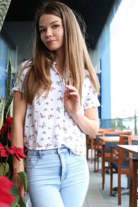 Magnetic teen Nedda A removes her jeans and poses nude on the terrace