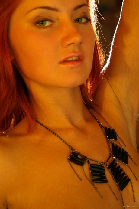 Young redhead Tamina hits upon great nude poses confidently