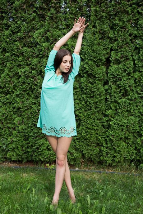 Thin teen Evita Lima strips & poses nude in the middle of a field