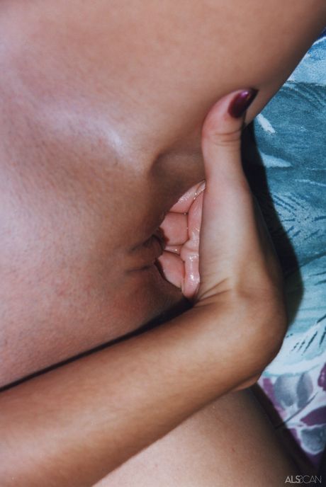 Seductive amateur teen babe stripping and masturbating her shaved pussy