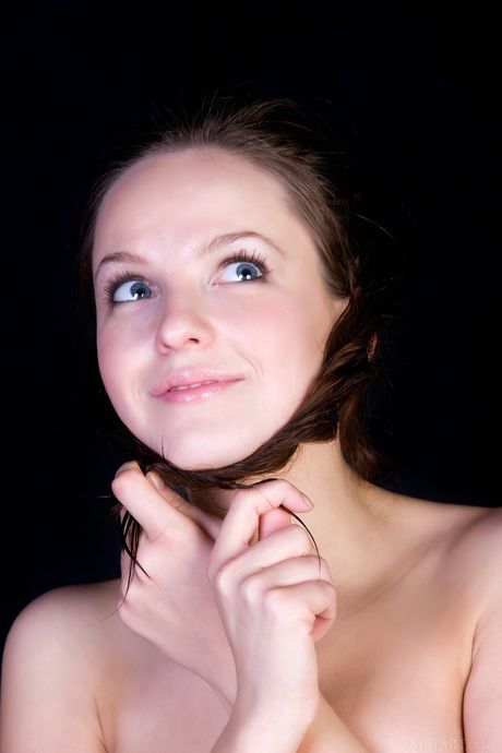 Endearing teen Ilze A removes a bikini and panties to get naked