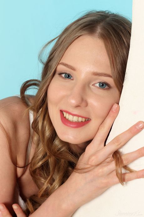 Bashful teen Nimfa removes her lingerie to pose nude in her bedroom