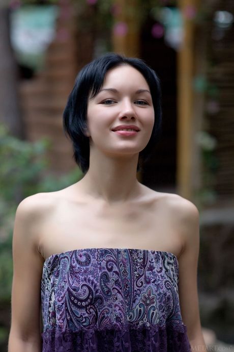 Svelte teen Loreen A strips and poses nude in the garden