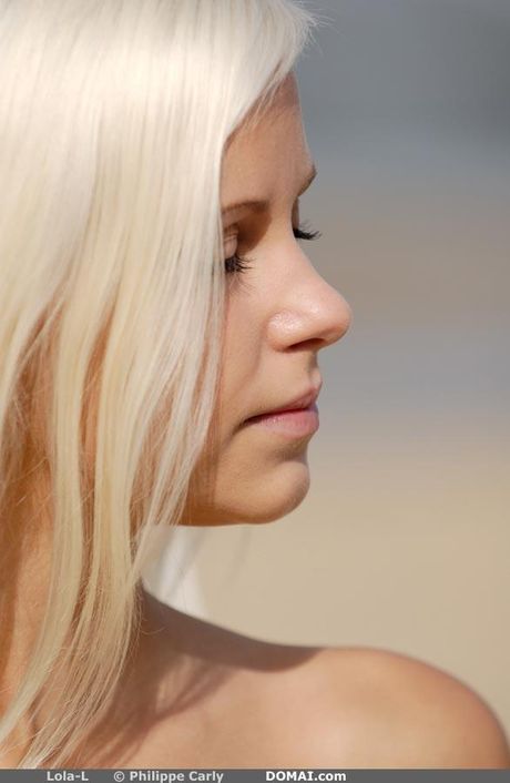 Slender teen Dido A removes her bikini to pose nude in a public place