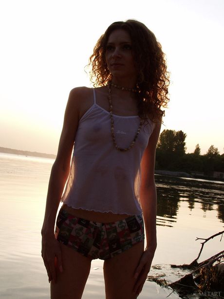 Skinny teenage babes posing naked on the beach and showing their holes