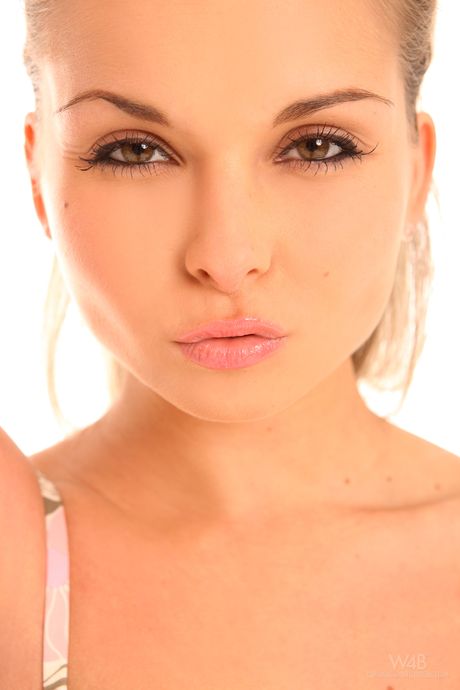 Beautiful brunette Divinity Love undresses and shows her hot body